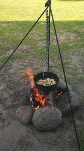 During the camping trip, the Eicher family put the tripod and kettle that the children recently gave to their father to good use.